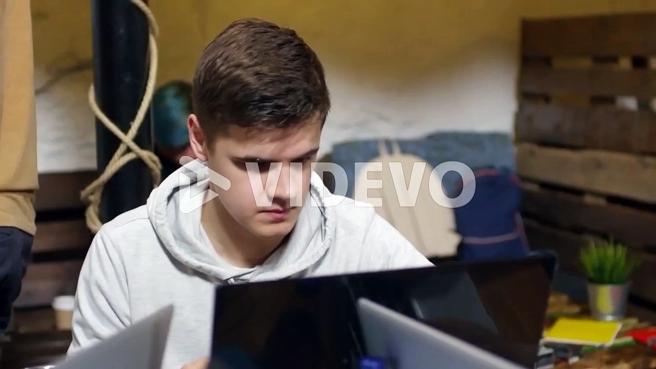 Young Man Using Laptop Computer