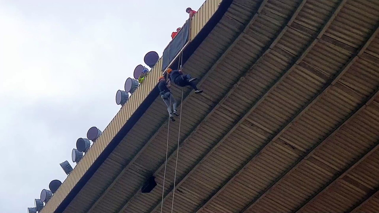 John Richards abseils from Molineux roof