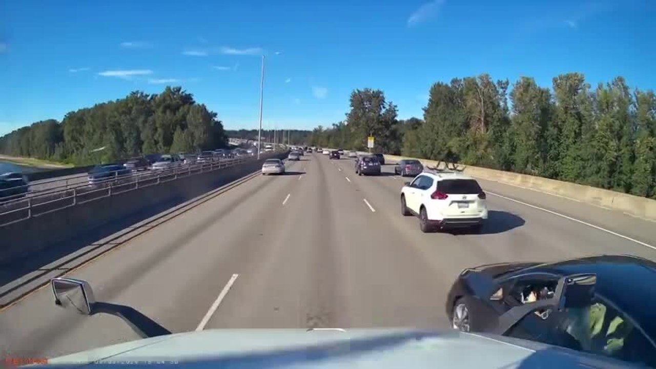 Car Crashes Into Semi-Truck While Overtaking it