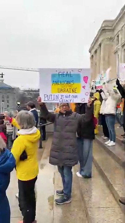 Protestors rail against President Donald Trump at State Capitol Tuesday