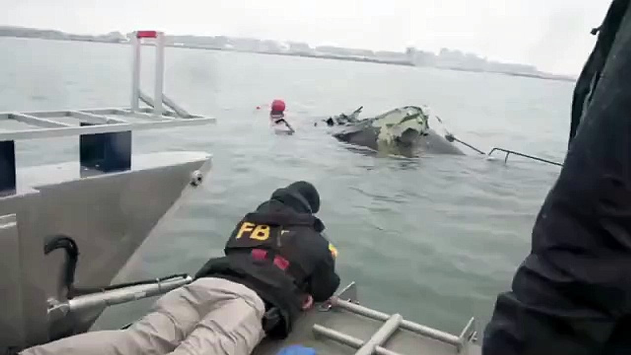 Crews comb through US army helicopter wreckage after DC plane crash