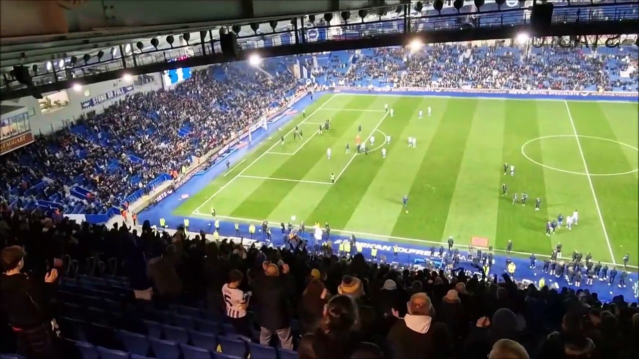 Brighton players and fans celebrate beating Chelsea in FA Cup