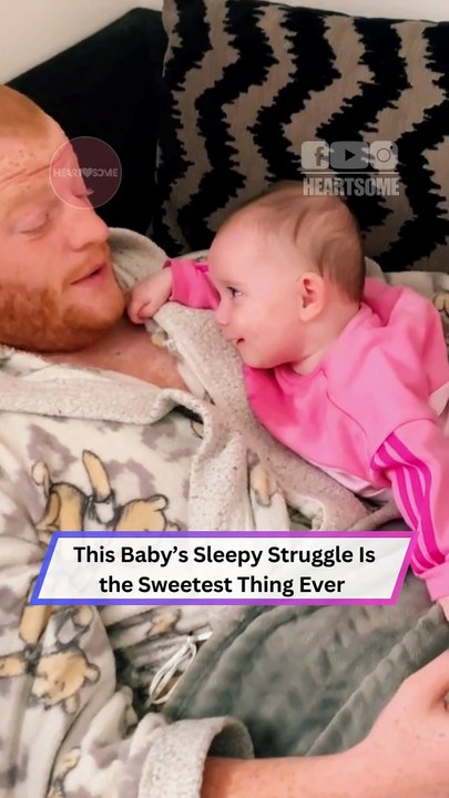 Sleepy Baby Fights to Stay Awake… Until Dad Makes Her Smile