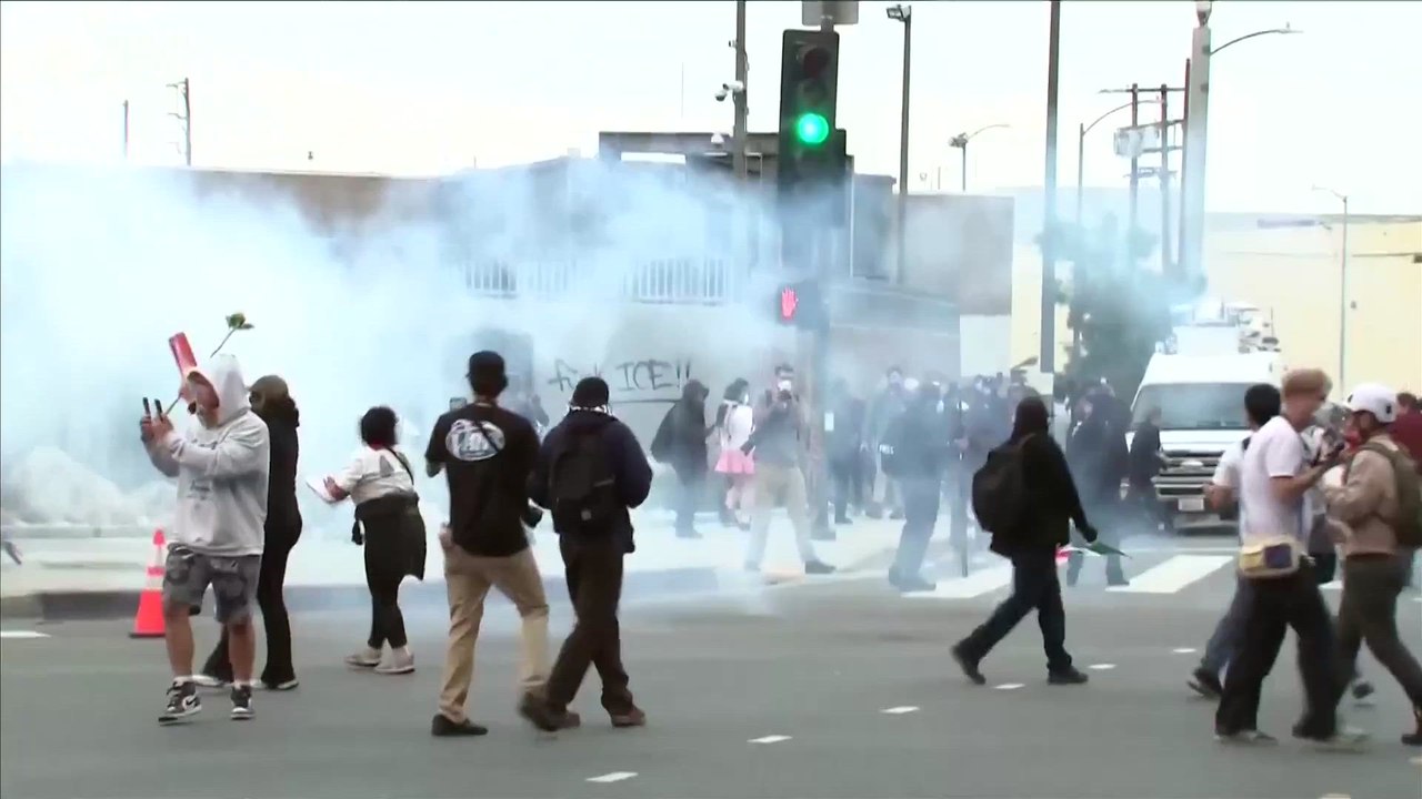 Tear gas fills LA streets as protesters clash with police following ICE raids