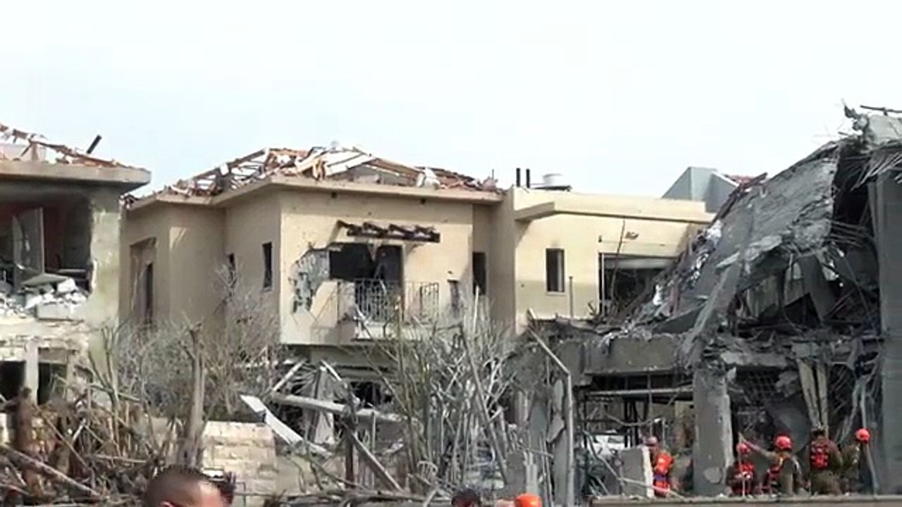 First responders operate at an impact site in Israel