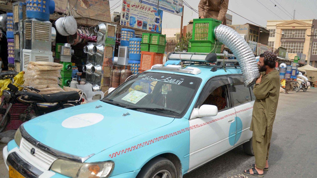 Afghan Taxi Drivers Get Creative with Air Conditioning Solutions 🚖