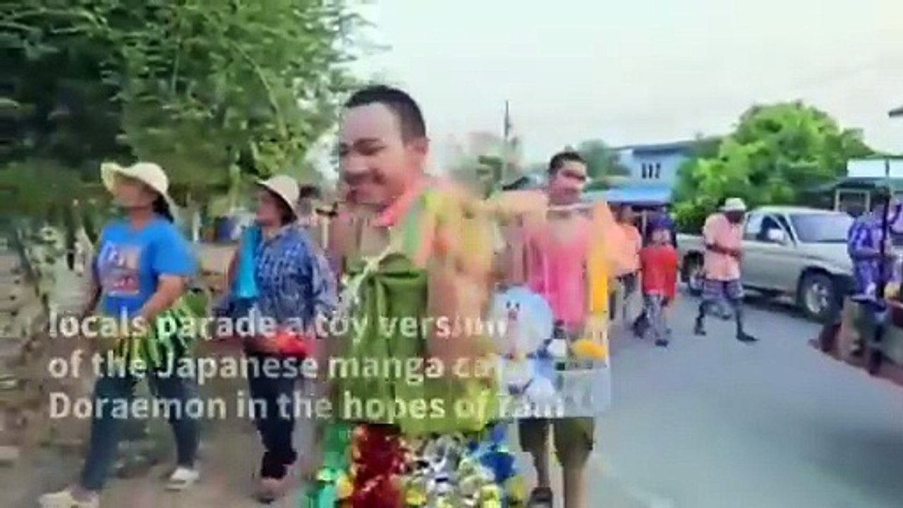 A rain-making ceremony held in Thailand_ which used a Doraemon plush toy