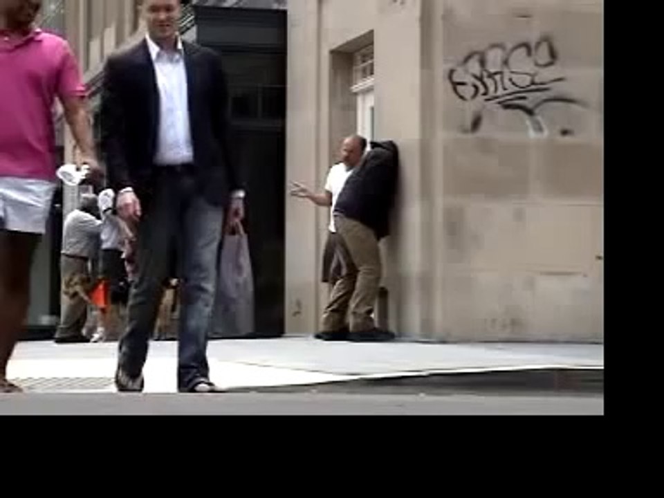 Embedded Man Standing by Wall 🌐