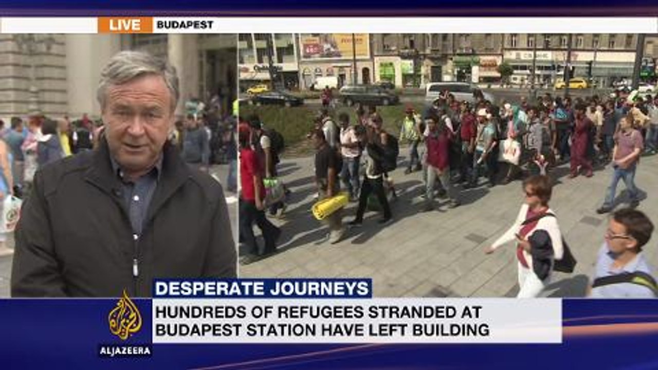 Syrian refugees embark on journey from Hungary to Austria