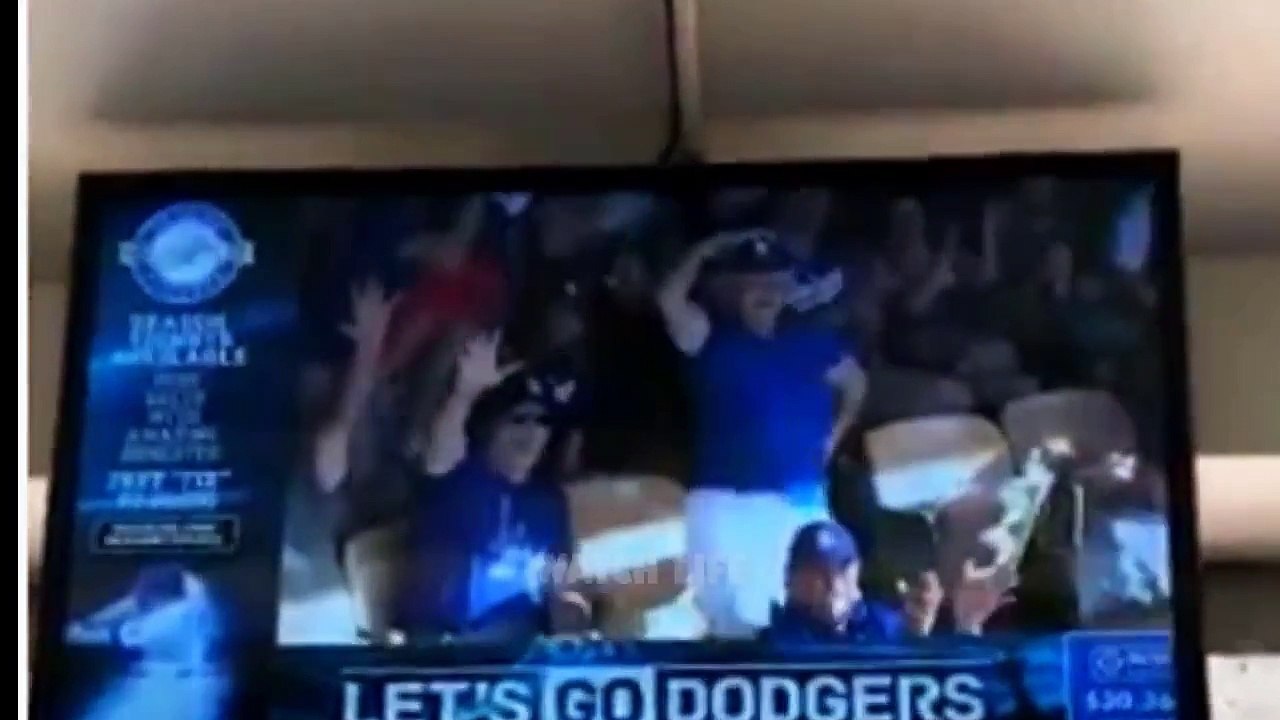 Elderly woman flashes Dodger Stadium crowd