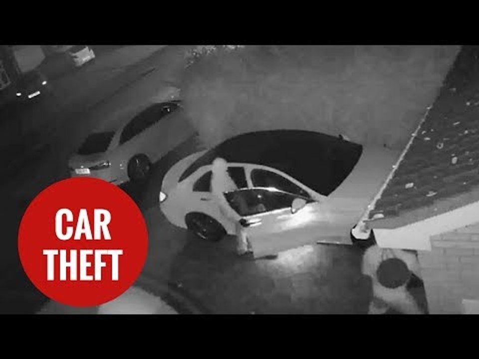 CCTV of thieves stealing a vehicle without the key by using a relay box.