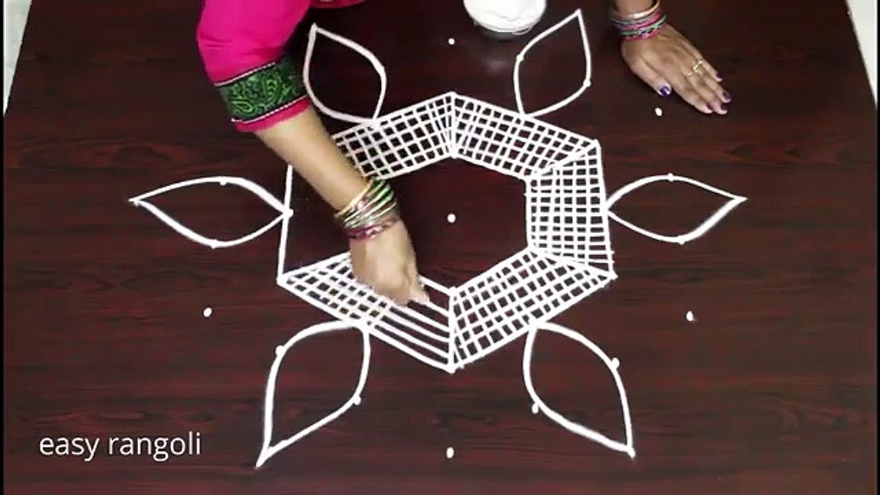 Beautiful and simple symmetrical kolam designs with 7 dots - New Rangoli Designs - Latest muggulu