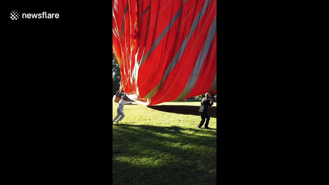Man clings onto hot air balloon rope in terrifying Lyon street act