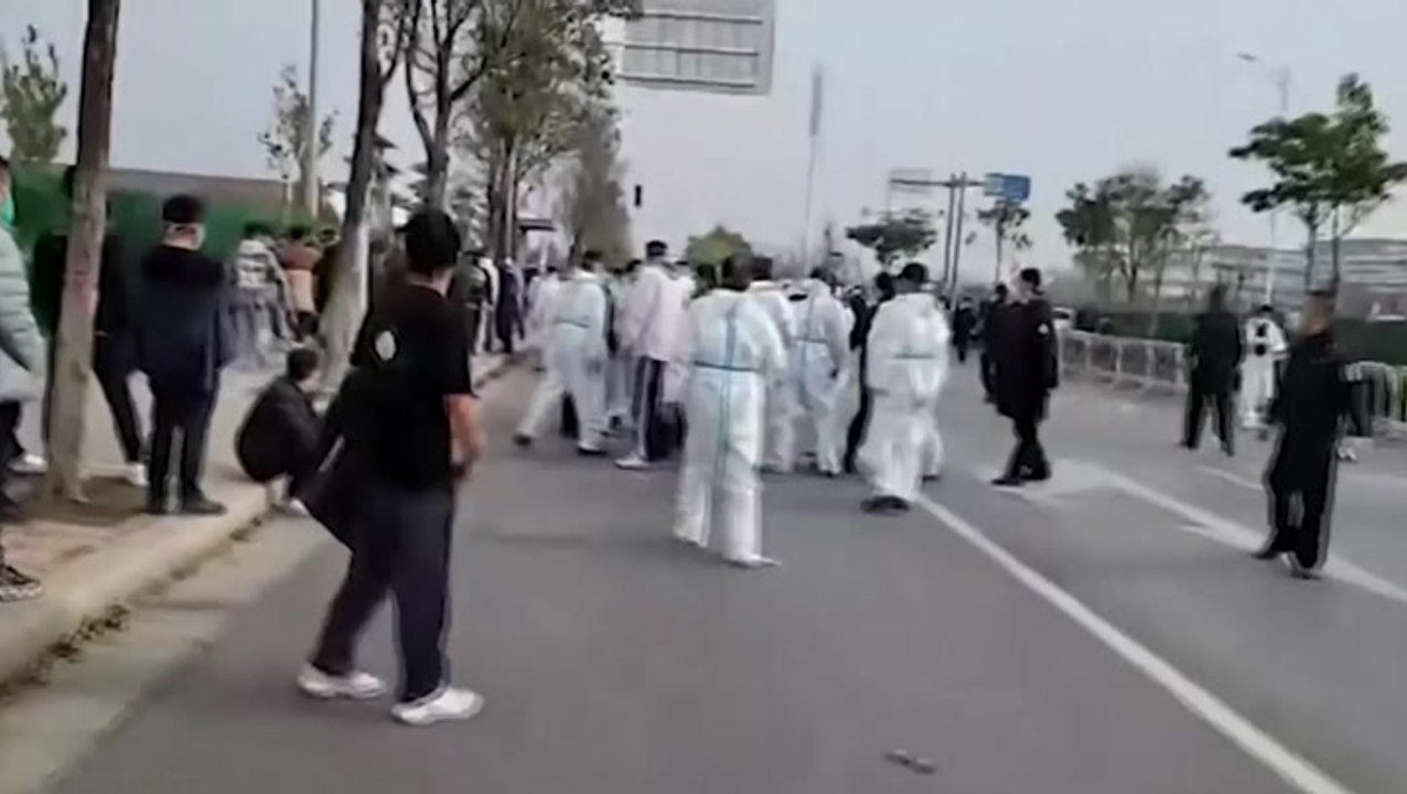 China: Protesting workers beaten by police at iPhone factory amid contract dispute