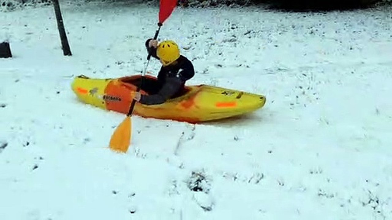 Thrill-seeker rides canoe down hill in the snow