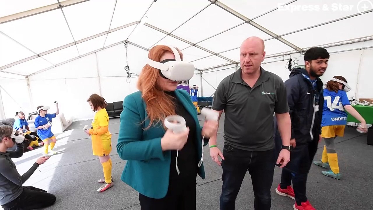 Wolverhampton MP Jane Stevenson attempting a VR goalie challenge.