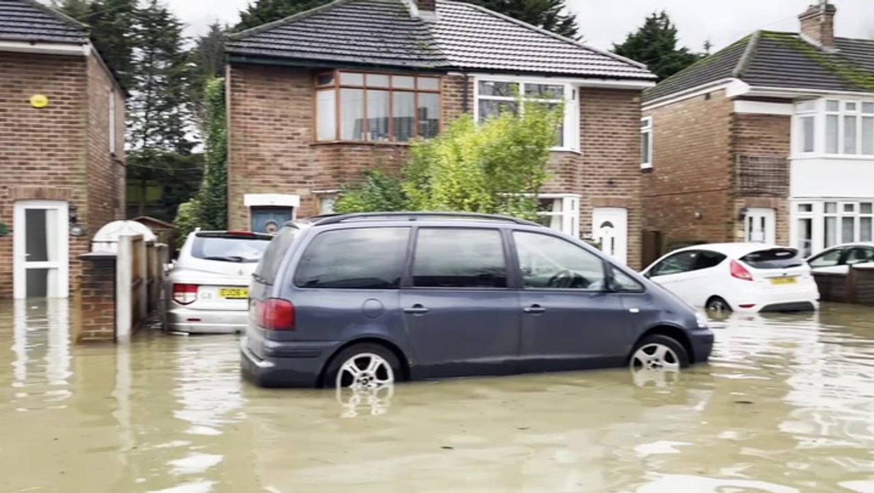 Residents wade through flooded Loughborough road after Storm Henk