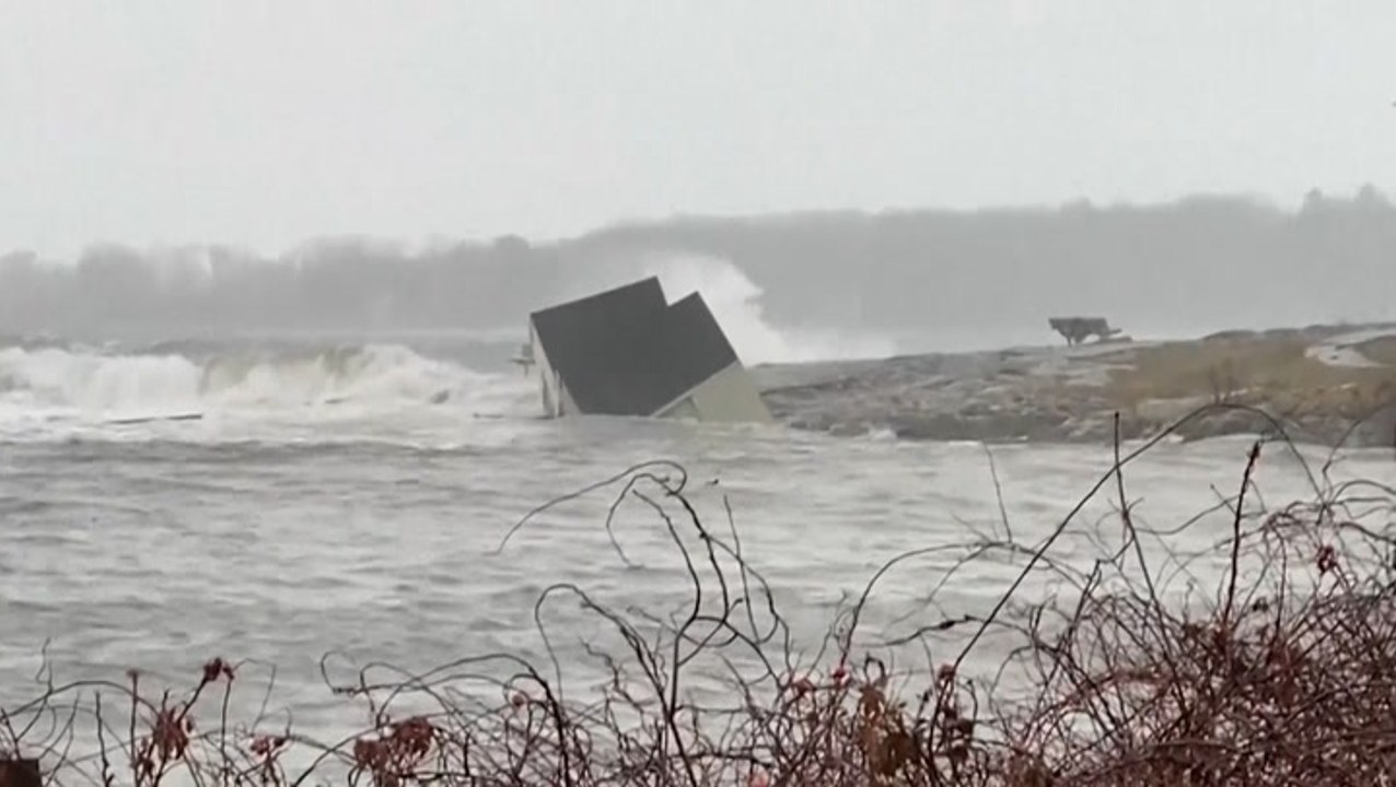 Moment 19th century fishing hut wiped out by 15ft wave in Portland