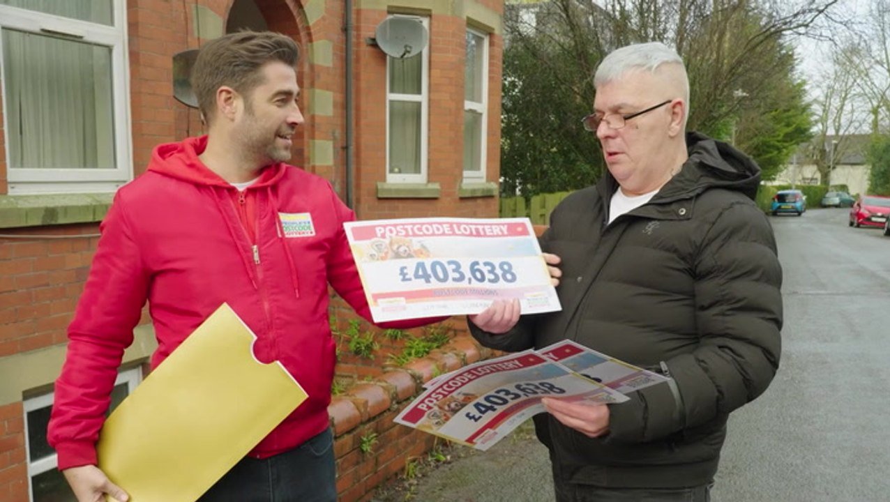 Biggest Postcode Lottery winner ‘still in shock’ as he is presented cheque
