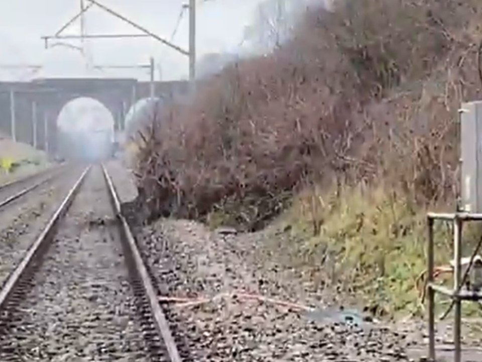 Engineers inspecting landslide on railway line
