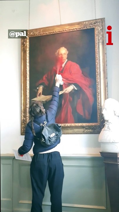 Palestine Action activists spray paint and slash painting