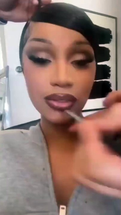 Cardi B shows off her broken veneer caused by eating a hard bagel