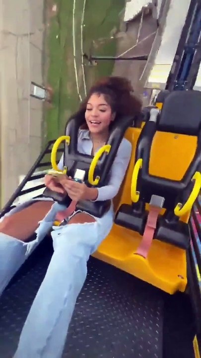 Girl uses phone on rollercoaster and finds out