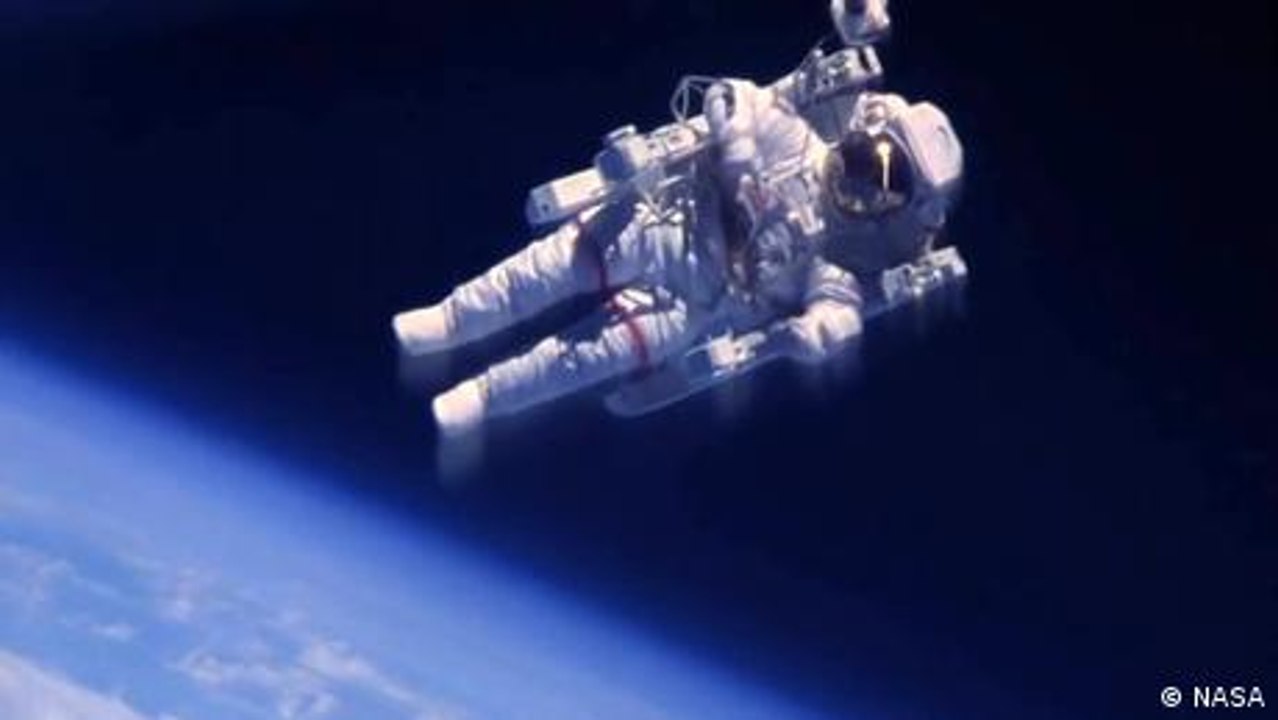 How do astronauts carry out spacewalks?