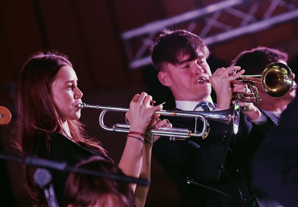 Talented musicians perform to pupils