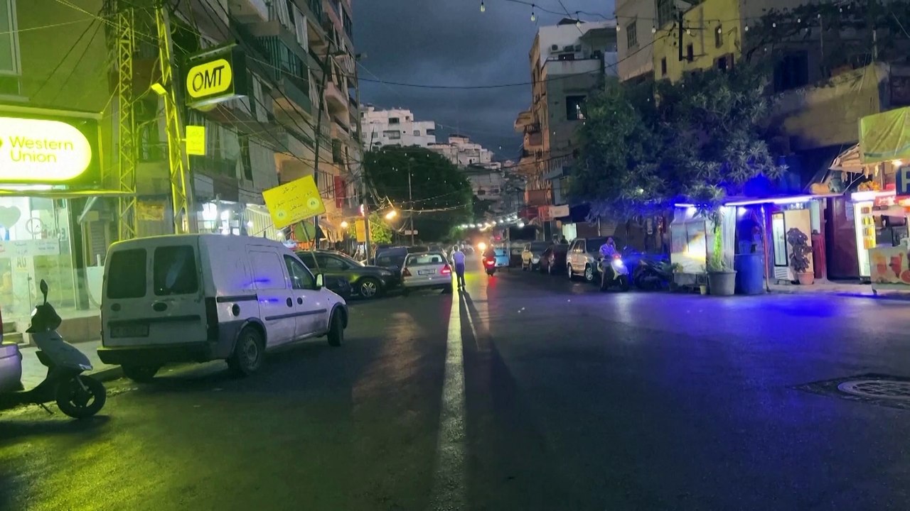 Lebanese shop owner removes electronic devices amid blasts