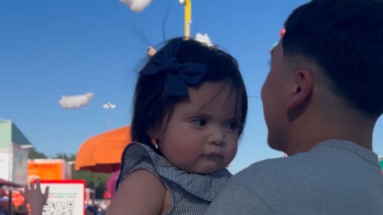 Baby girl bursts into tears after cloud hits her face at the fair