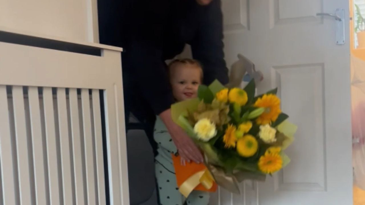 Baby girl takes over a bouquet that is meant for someone else