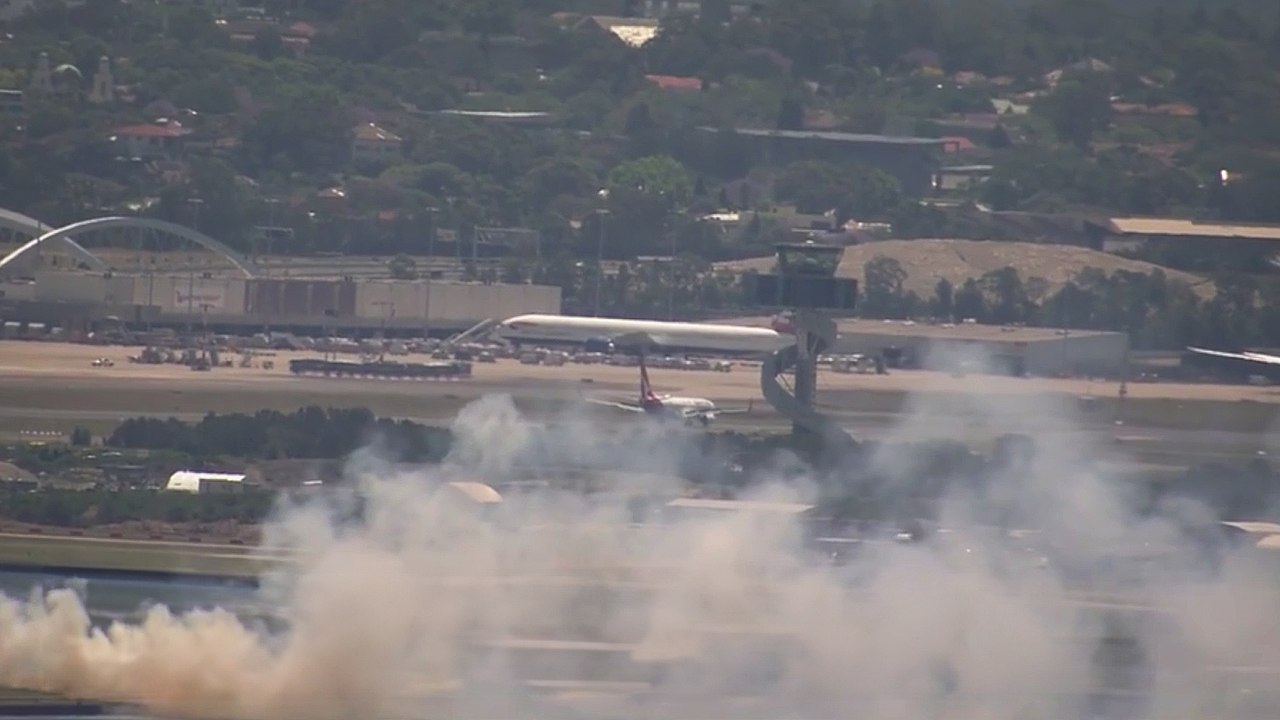 Sydney airport fire: Qantas 'engine malfunction' ignites grass fire