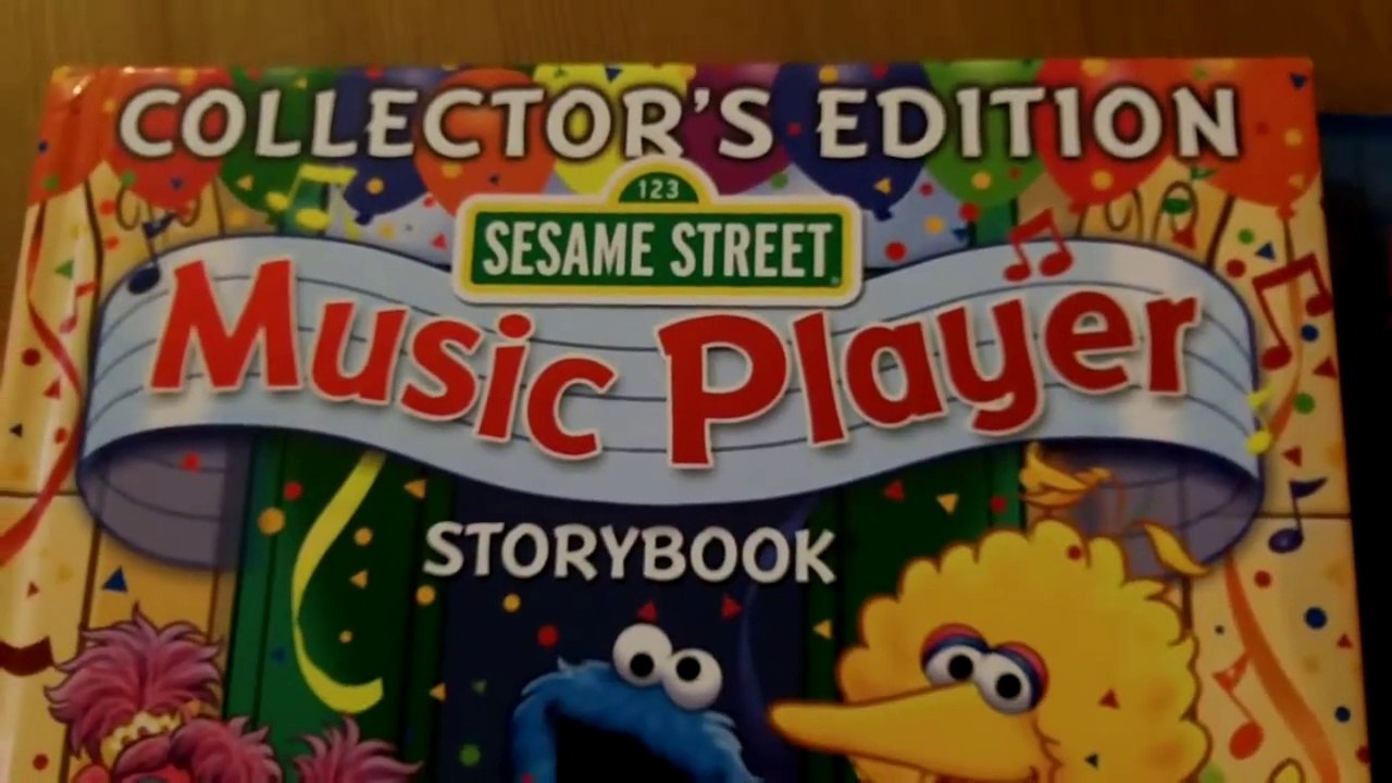 Sesame Street Music Player Storybook [With Music Player & 4 CDs] - Elmo CD Player