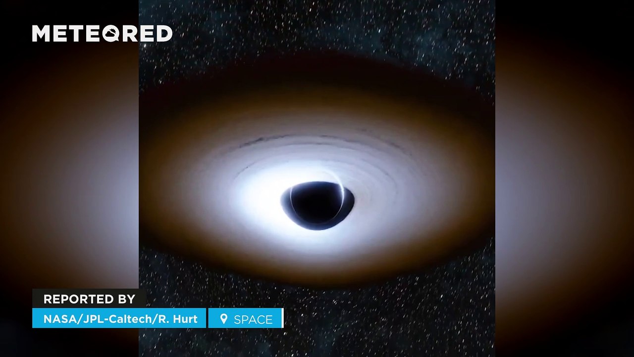 This is what a black hole surrounded by an accretion disk would look like! Light is distorted by its large gravitational fields.