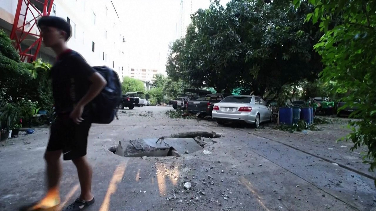 Bangkok road damaged by falling crane
