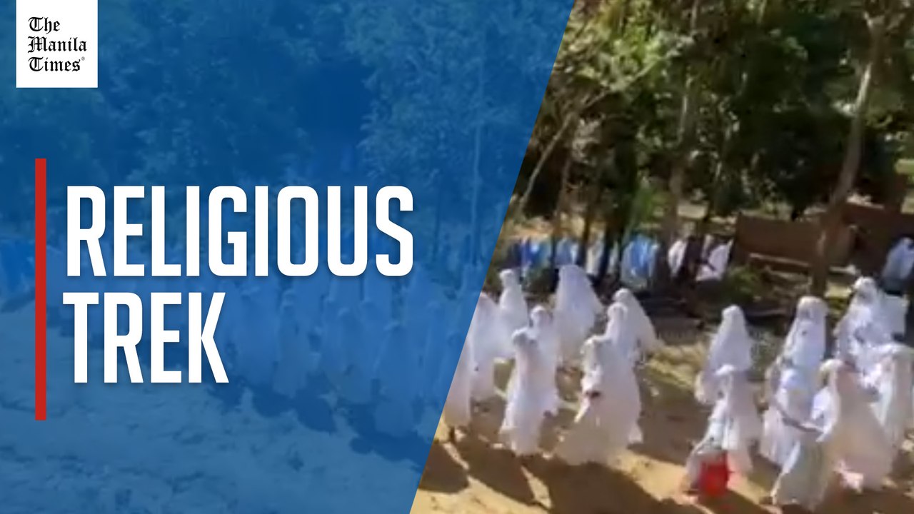 Catholic Church group walks through Stations of the Cross