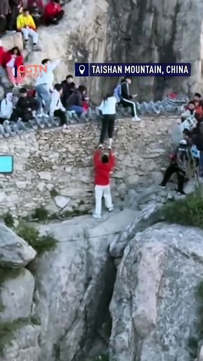 A dangerous moment: Couple nearly fall off cliff