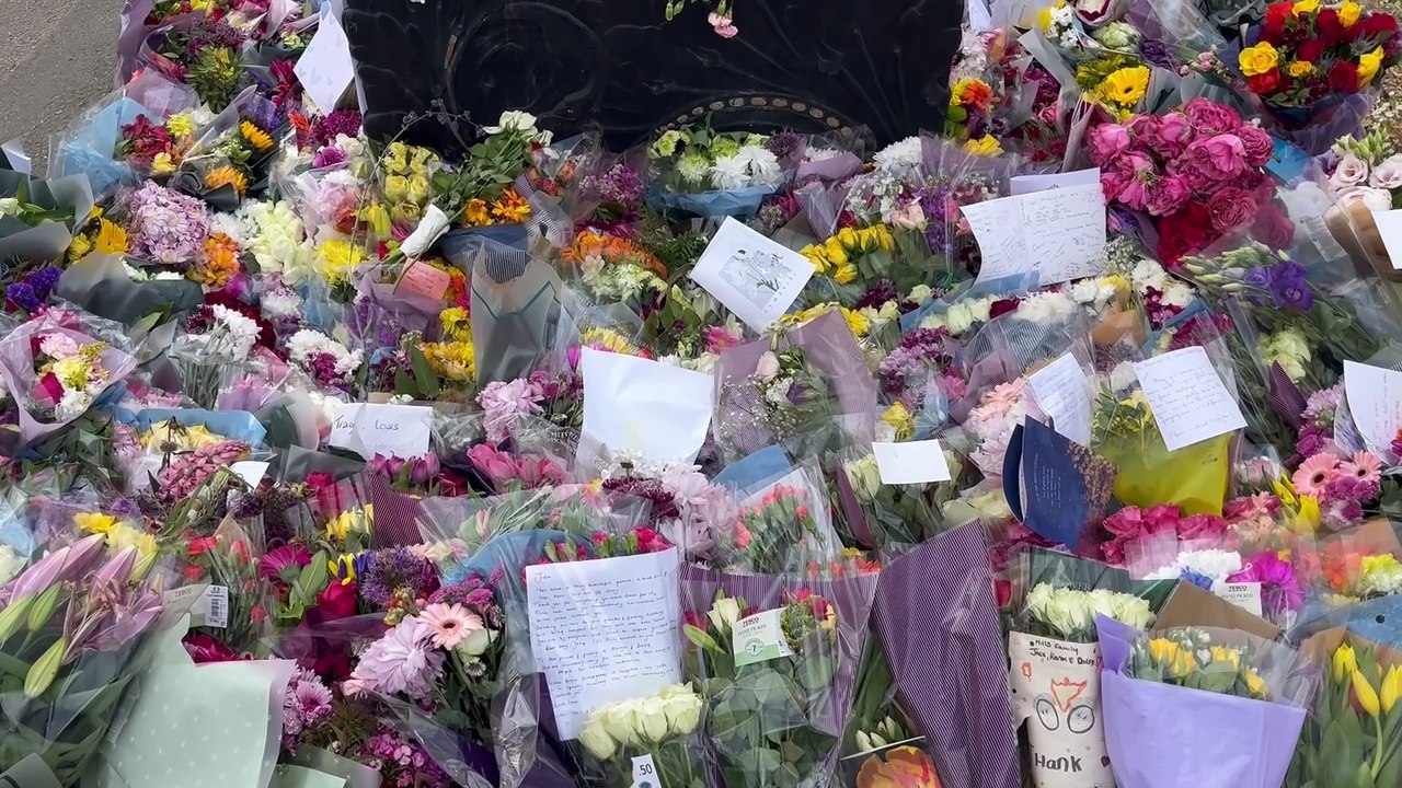 Flowers pile up in Garth Park, Bicester, in memory of the victims of the fire at Bicester Motion