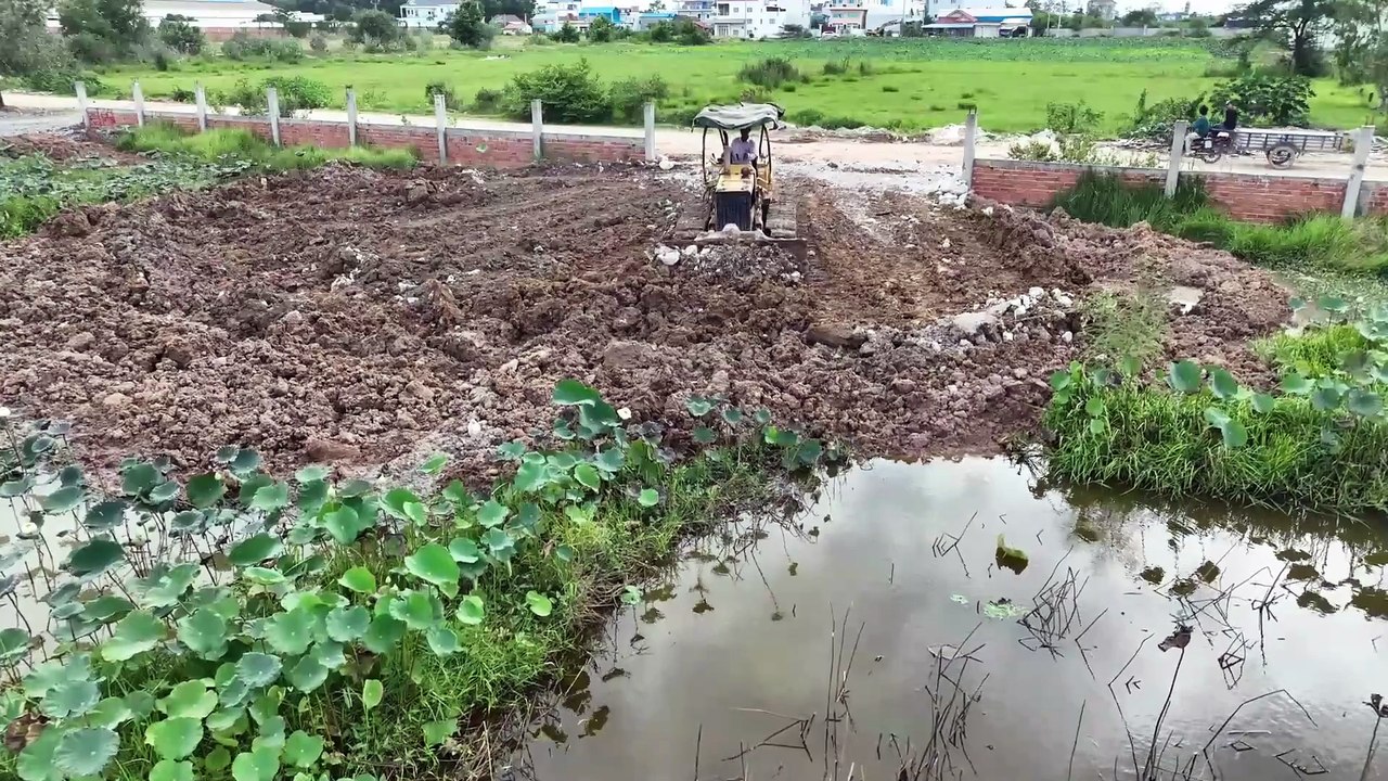 The New Project Land fill Talent Skill by Equipment Dozer D20P Pushing Soil with DumpTruck Spreading