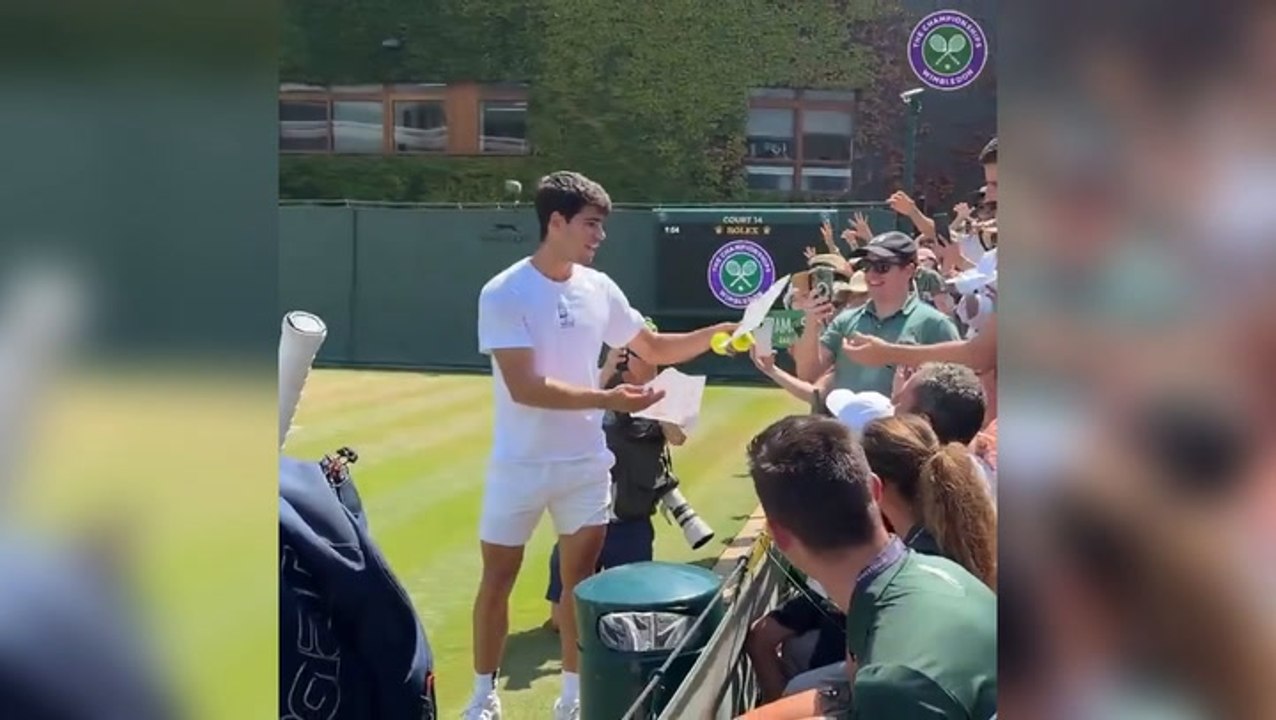 Relaxed Carlos Alcaraz hands out tennis balls to fans before Wimbledon final