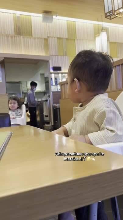 Baby Nods at Another Baby and Receives Sweet Nod in Return