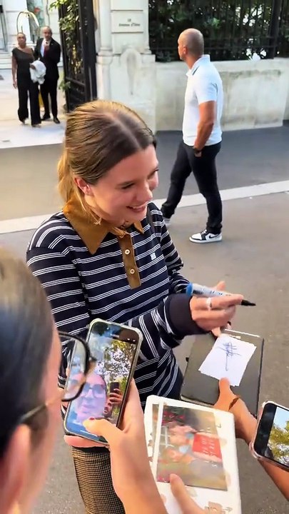 Sean Kaufman and Rain Spencer take photos with fans in Paris