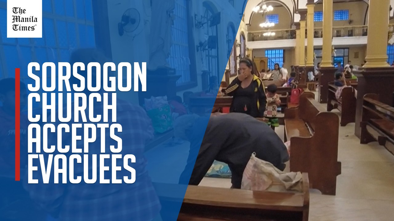 Filipinos take shelter in a church before Super Typhoon Uwan makes landfall